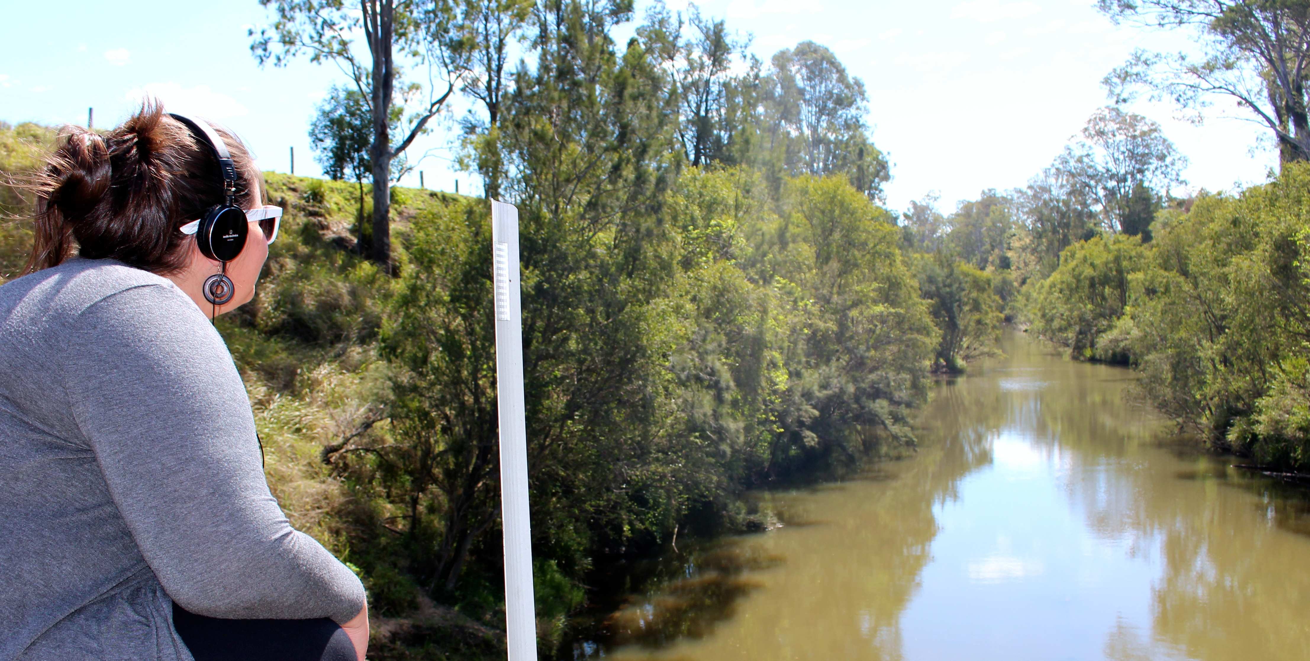 Dr Leah Barclay during a River Listening Lab on Logan River
