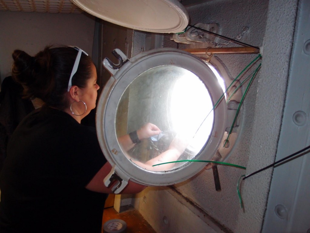 Leah installing hydrophones on the HMS Belfast